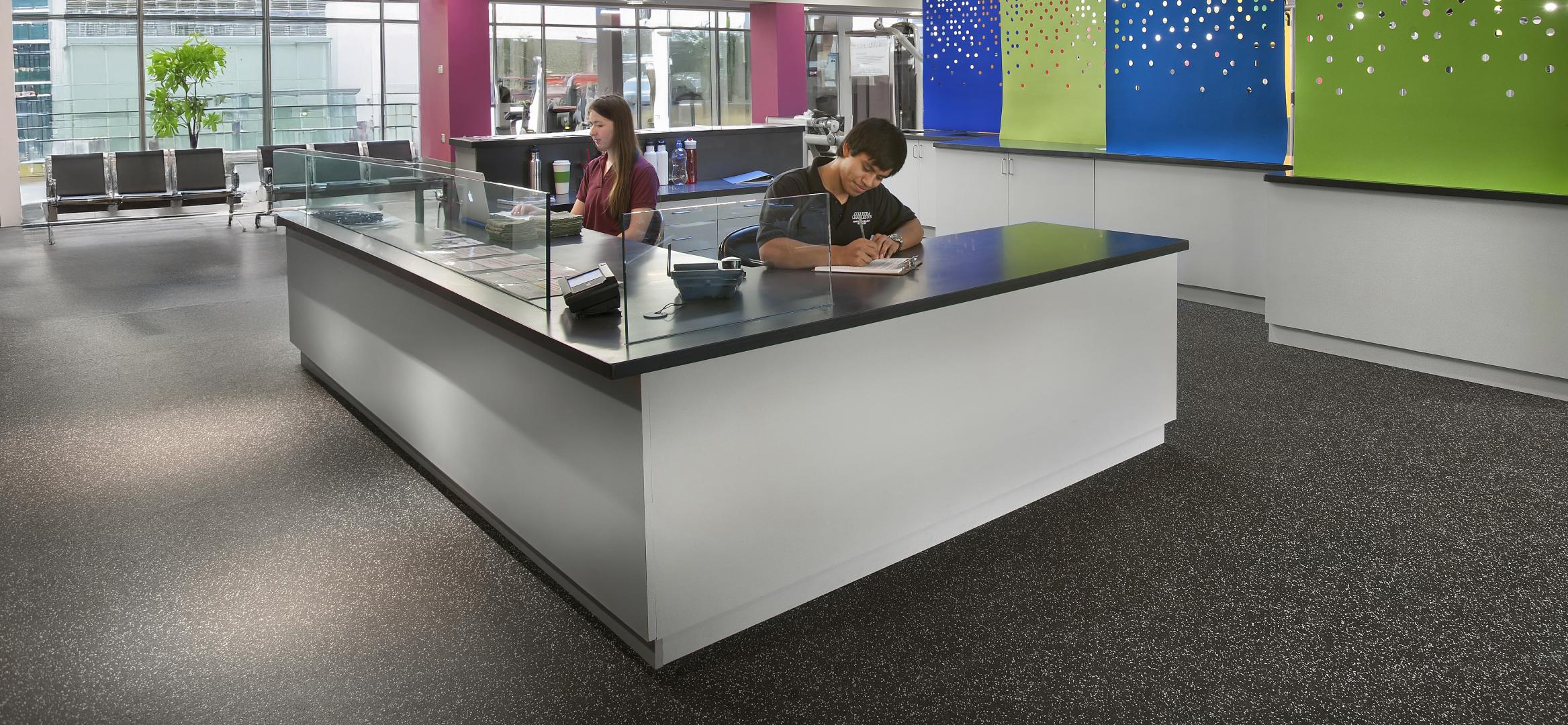 Two individuals sitting at a desk