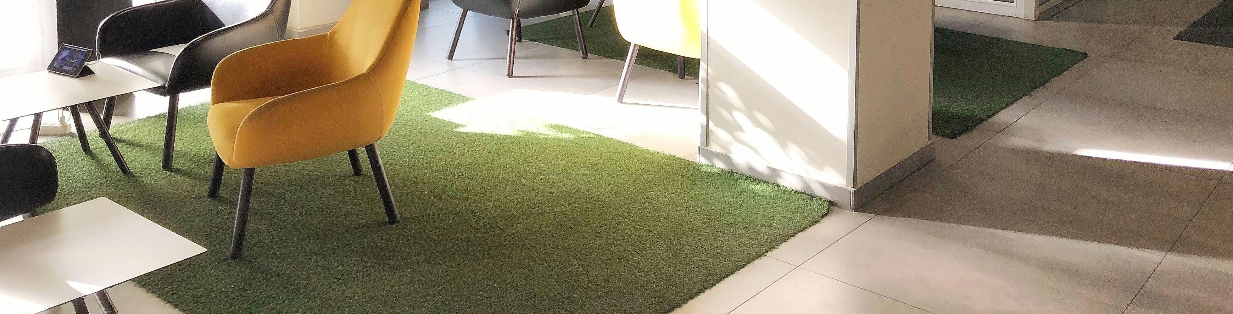 an office setting with turf installed under the chairs